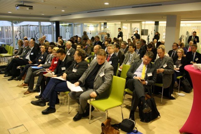 People sitting in chairs at seminar