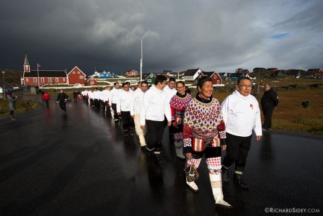 People walking with rainy clouds