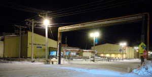 School building with streets in front covered in snow