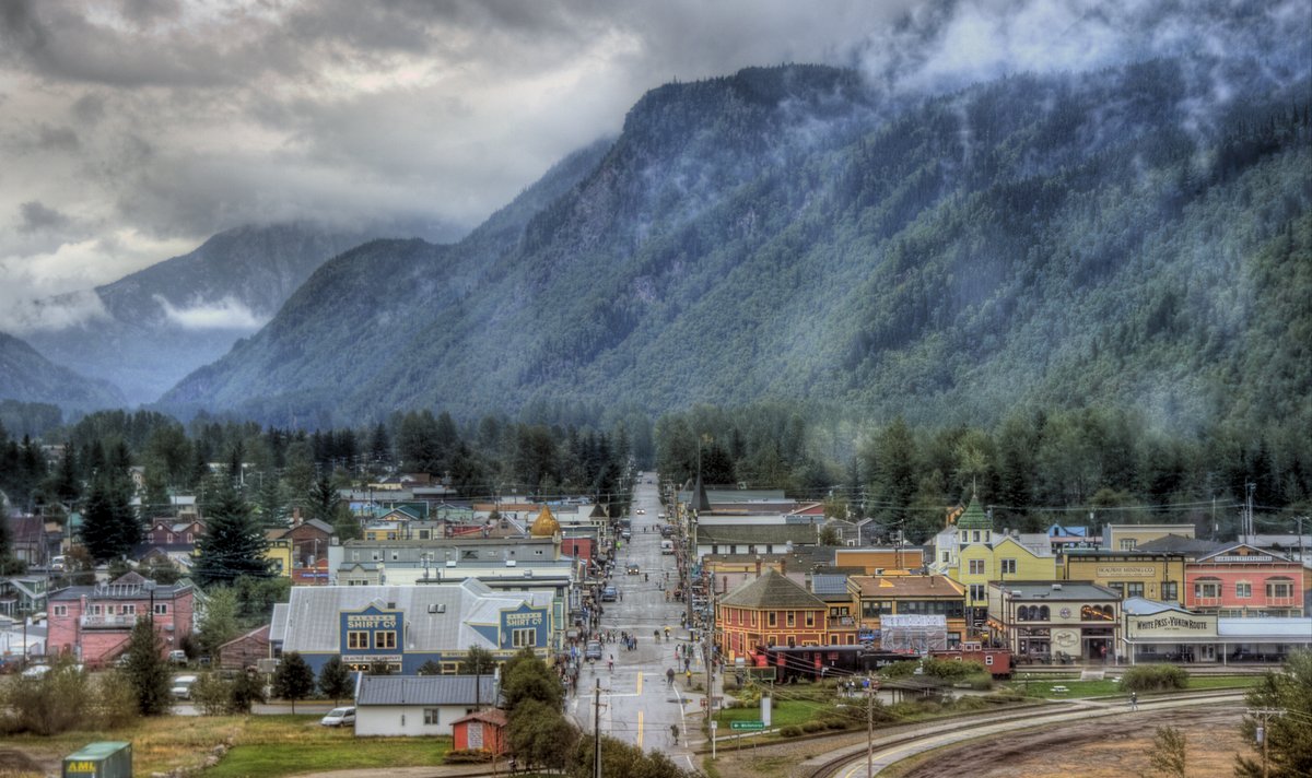 Small town, its main street and mountains in the back
