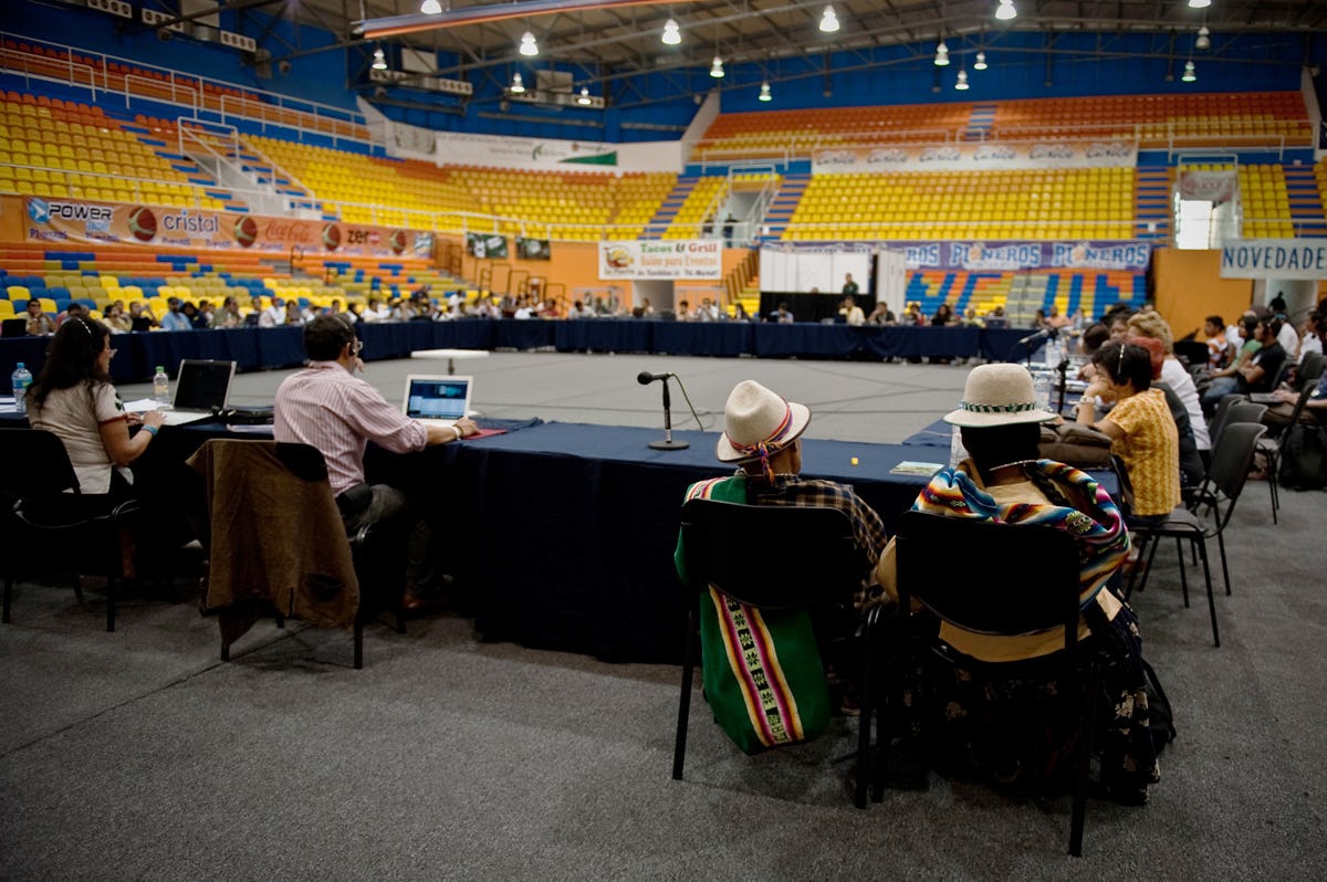 People sitting around big table in stadium