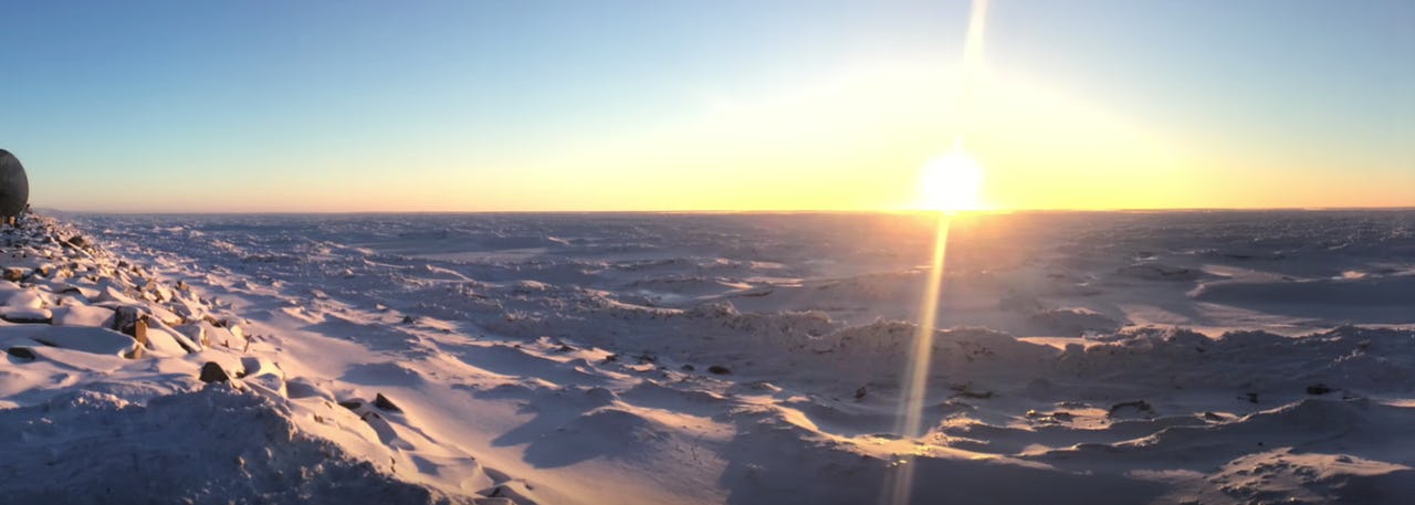 Snowy landscape with sun shining