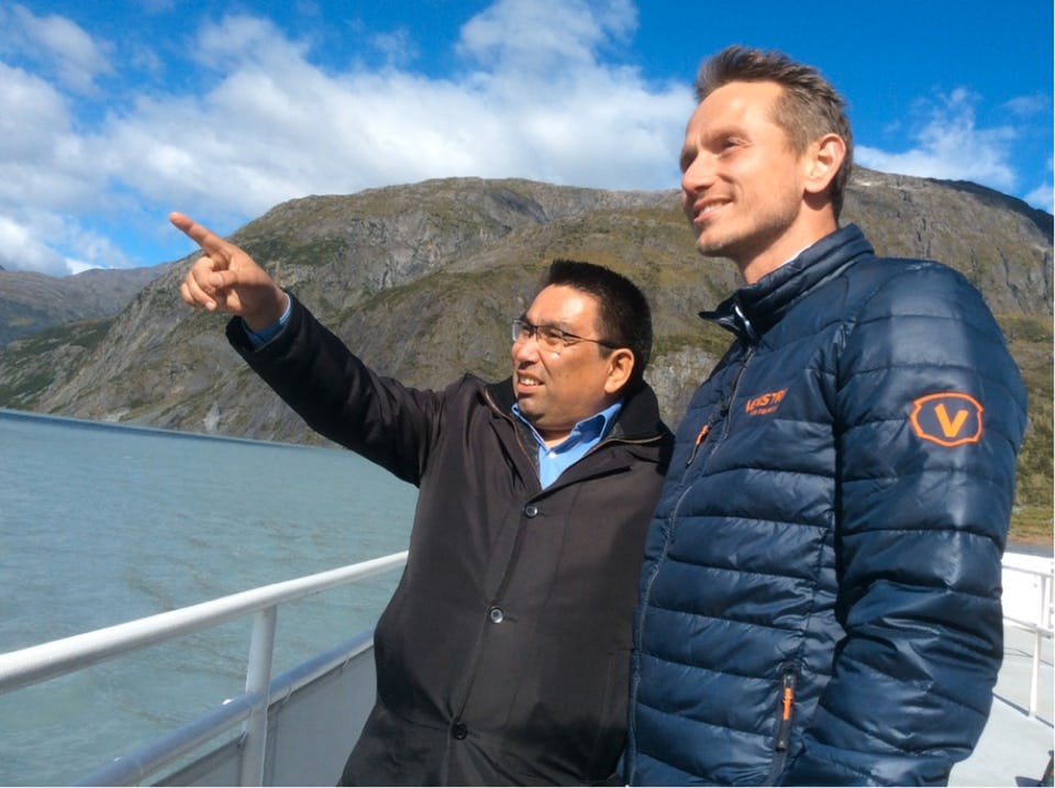 Two men standing on vessel