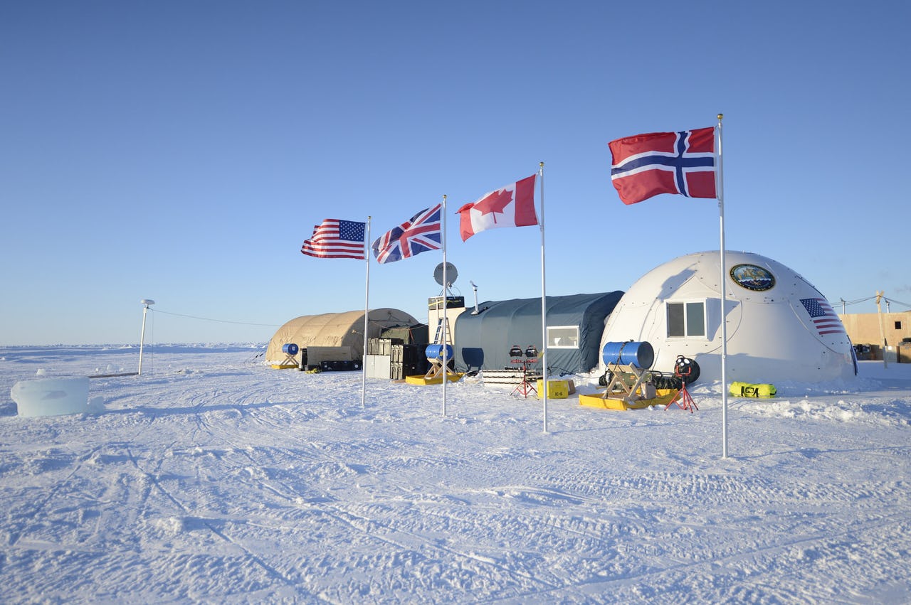 Ice camp and four flag poles
