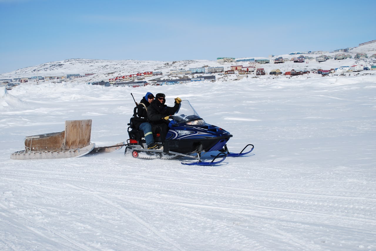 Snowmobile ride in Frobisher Bay, Iqaluit on a sunny day
