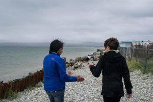 Two woman walking on a beach