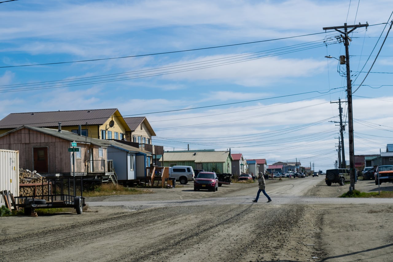 A gravel road with someone walking