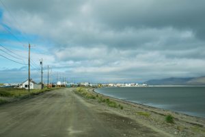 Gravel road with town in the background