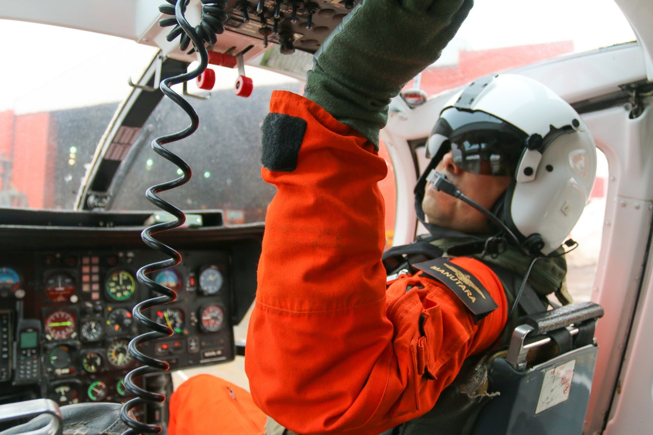 Pilot in helicopter cockpit before start
