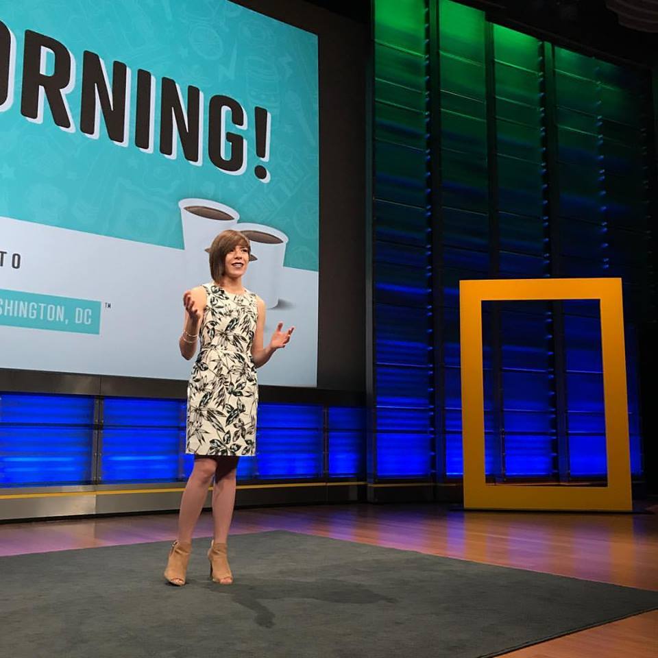 Woman presenting on stage