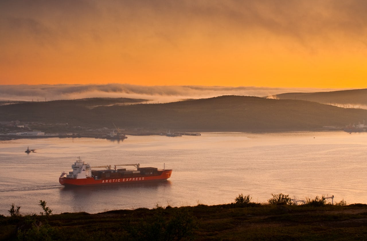 Vessel leaving port in the morning