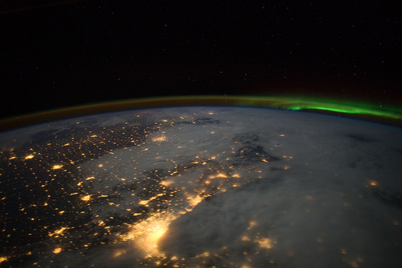 View of parts of the earth from space with minor auroral activity (borealis)