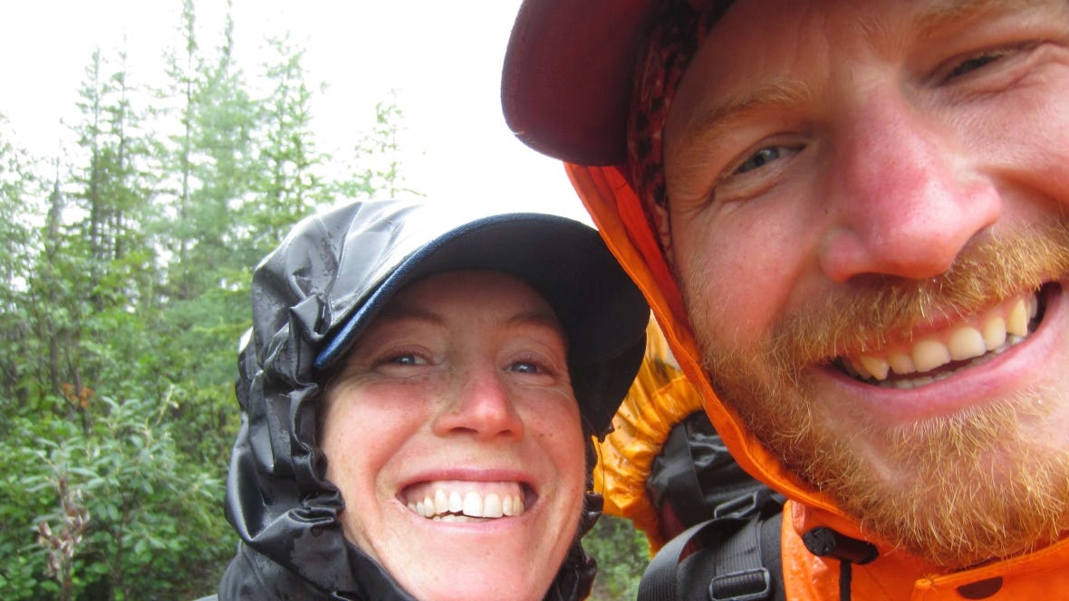 Two people smiling into camera