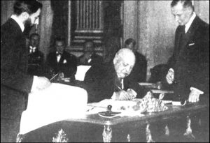 Black and white image of men signing a treaty