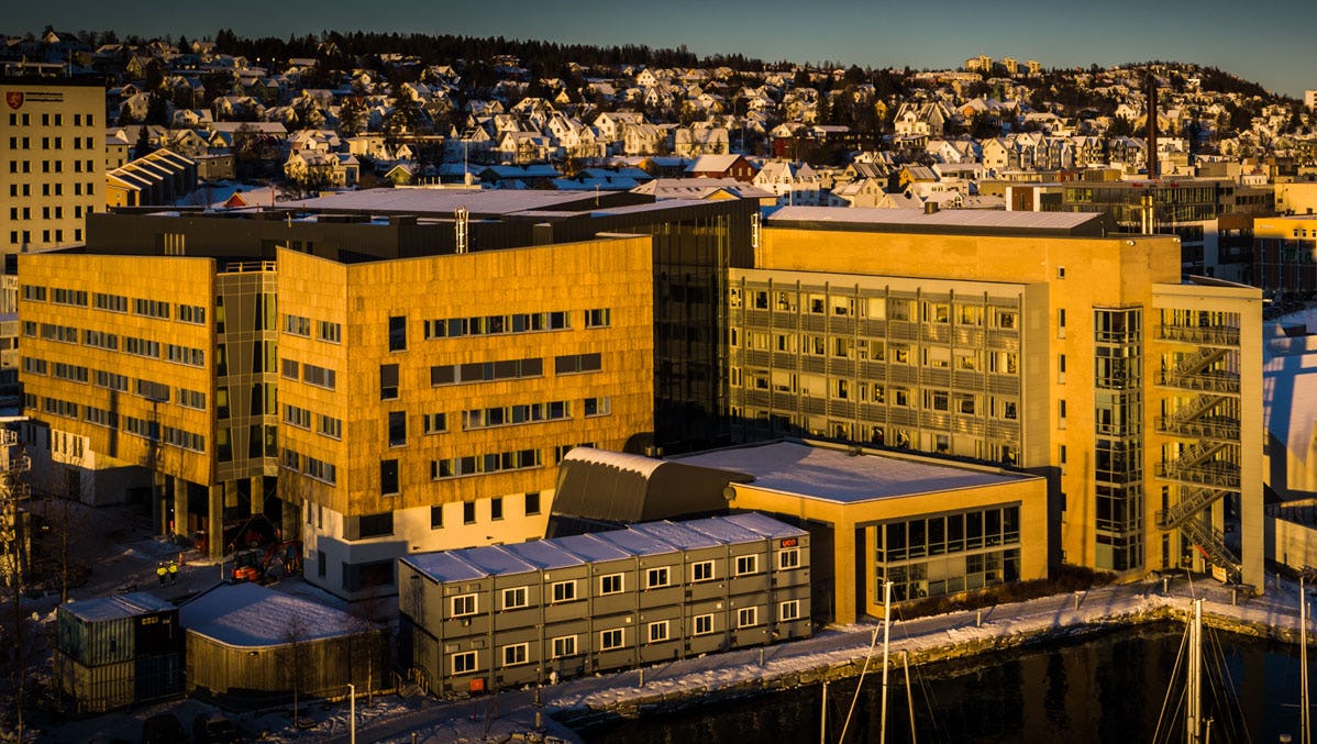 Buildings in the sun with city in the background