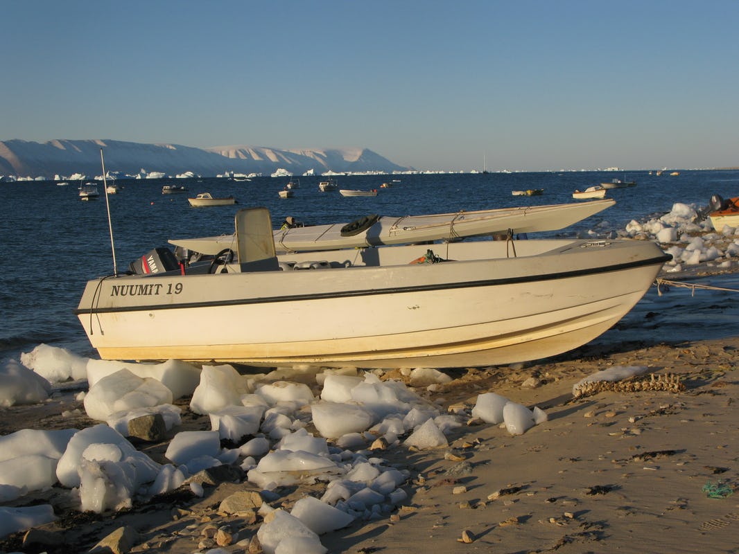 Qayak attached to dinghy with outboard motor