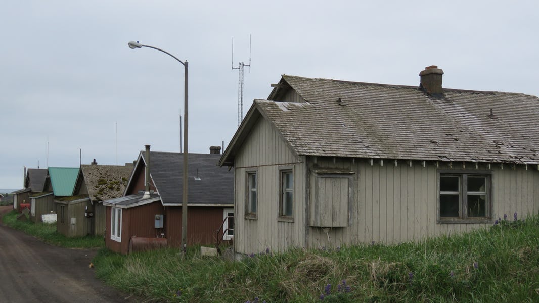 A street in the city of St. Paul, St. Paul Island, Pribilofs, Alaska, with houses in need of repair