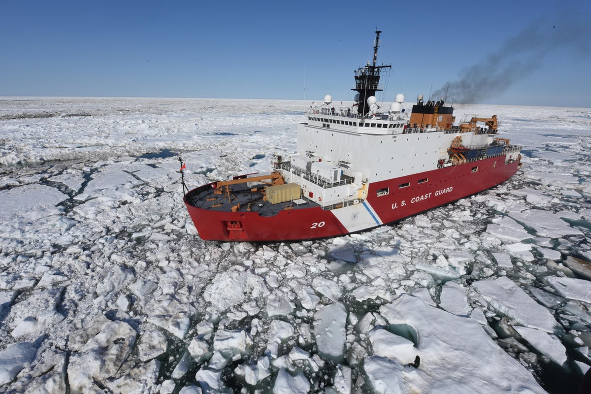 US icebreaker vessel cutting through Arctic ice