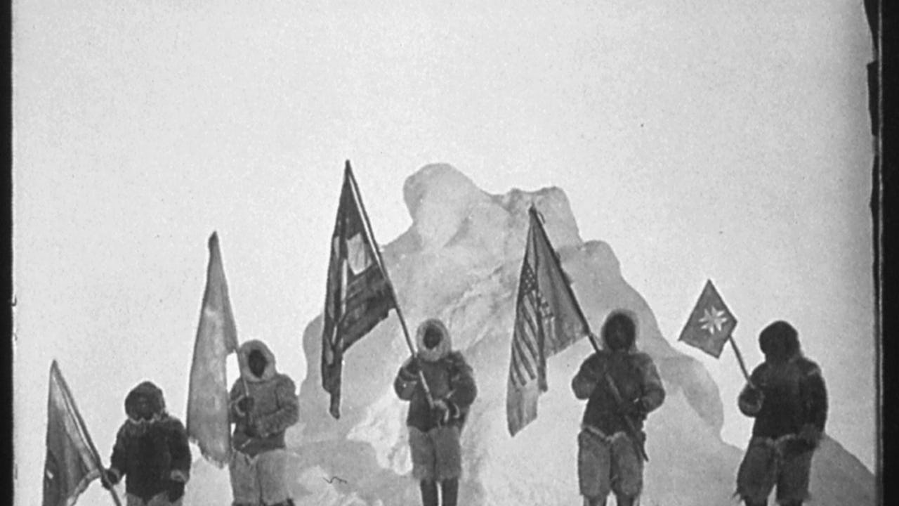 American polar explorer Robert Peary's flag party stands in front of what they claim to be the North Pole