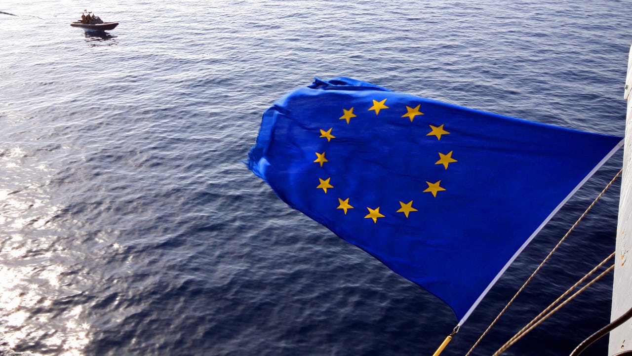 Flag of the European Union flying over water