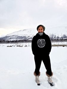 Woman standing on snowy underground