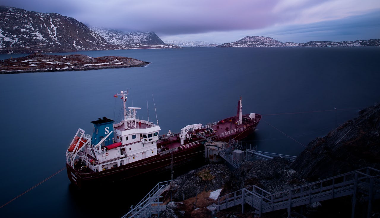 A ship docked in Nuuk located at the mouth of the fjord