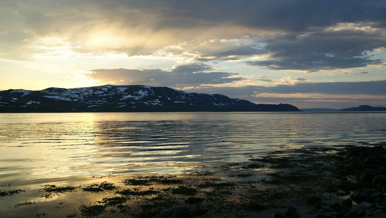 Ocean with mountain in the background