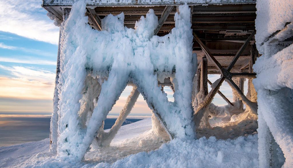 A metal platform covered in ice