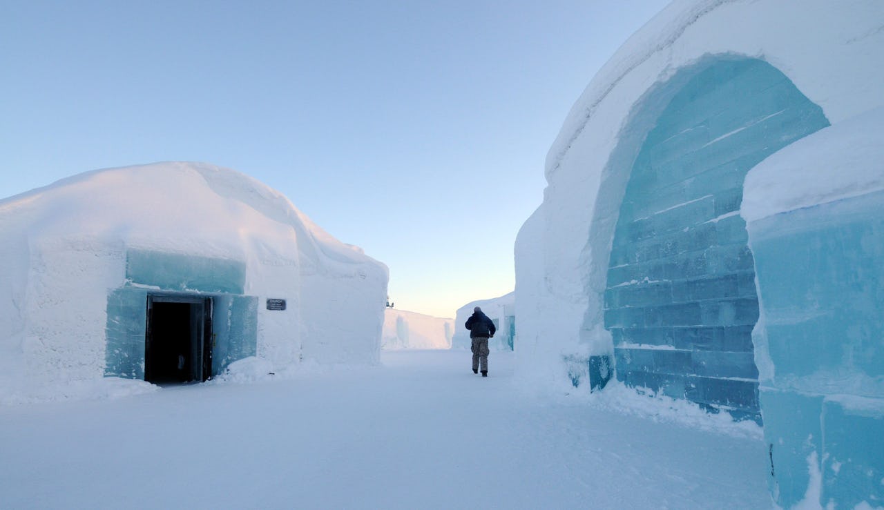 A security guard is seen patrolling the vicinity of the famous ice hotel in Jukkasjärvi