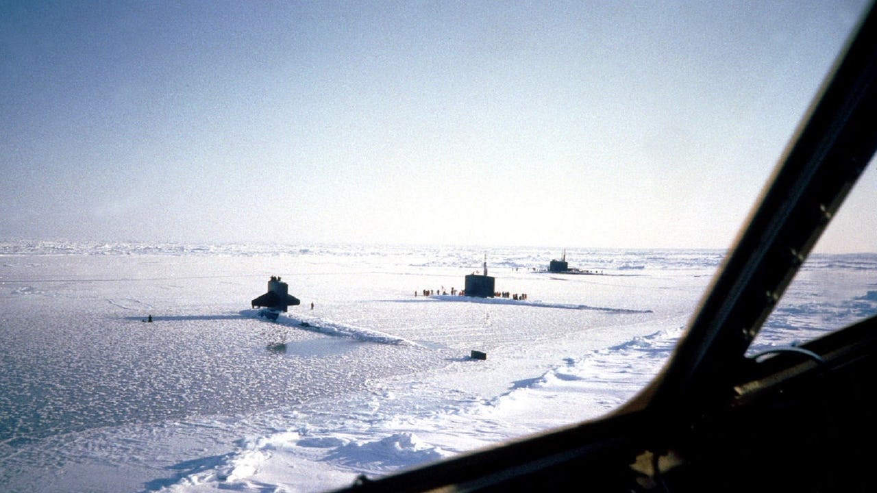 Three nuclear-powered attack submarines surface simultaneously at the North Pole