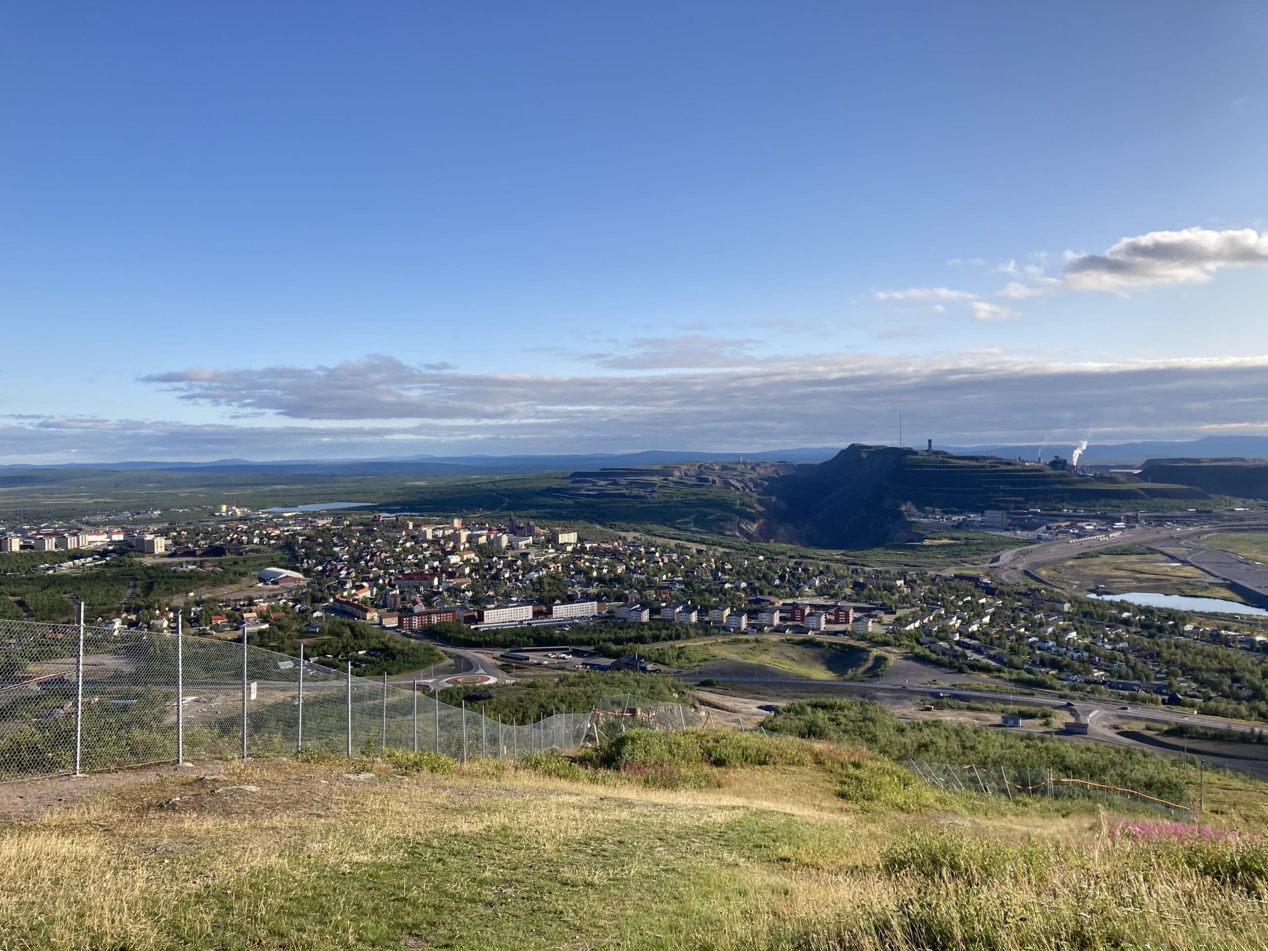 The city of Kiruna, Sweden, from above with the iron ore mine in the back