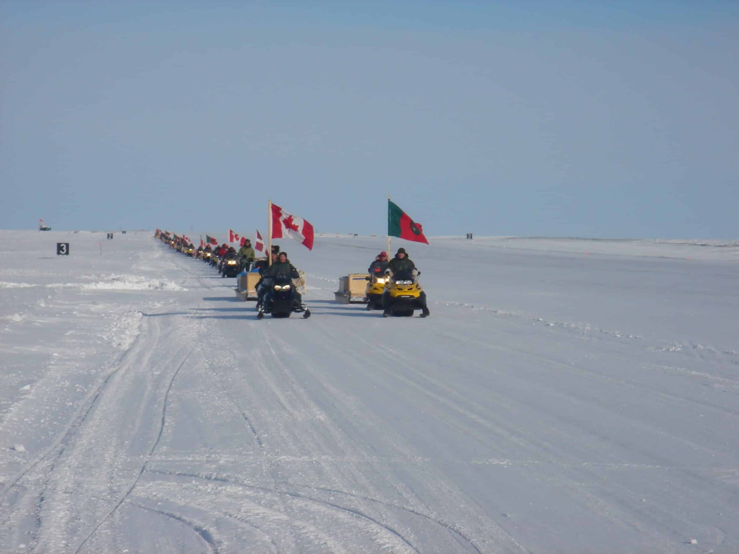 Canadian soldiers ride snowmobiles during a training exercise in Nunavut