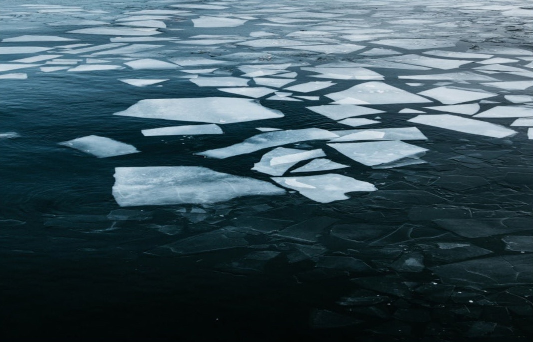Chunks of Arctic sea ice breaking up and melting into the ocean