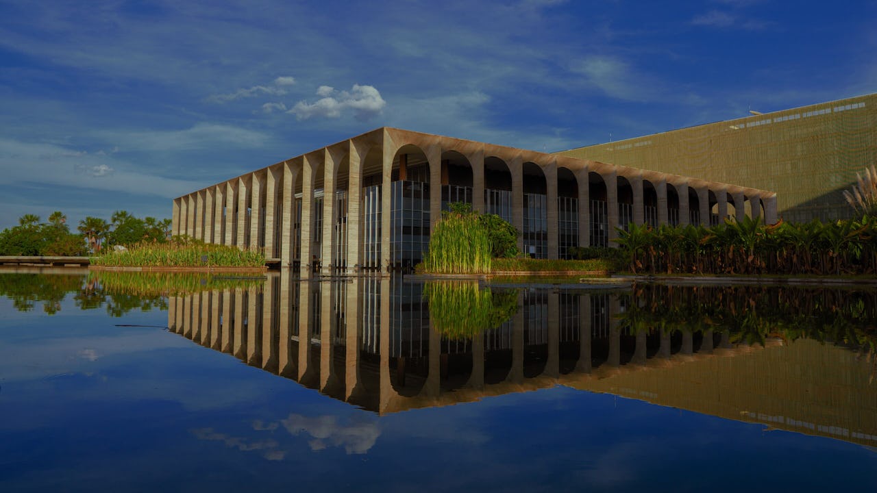 Itamaraty Palace, a building with modernist columns reflected by a water-mirror