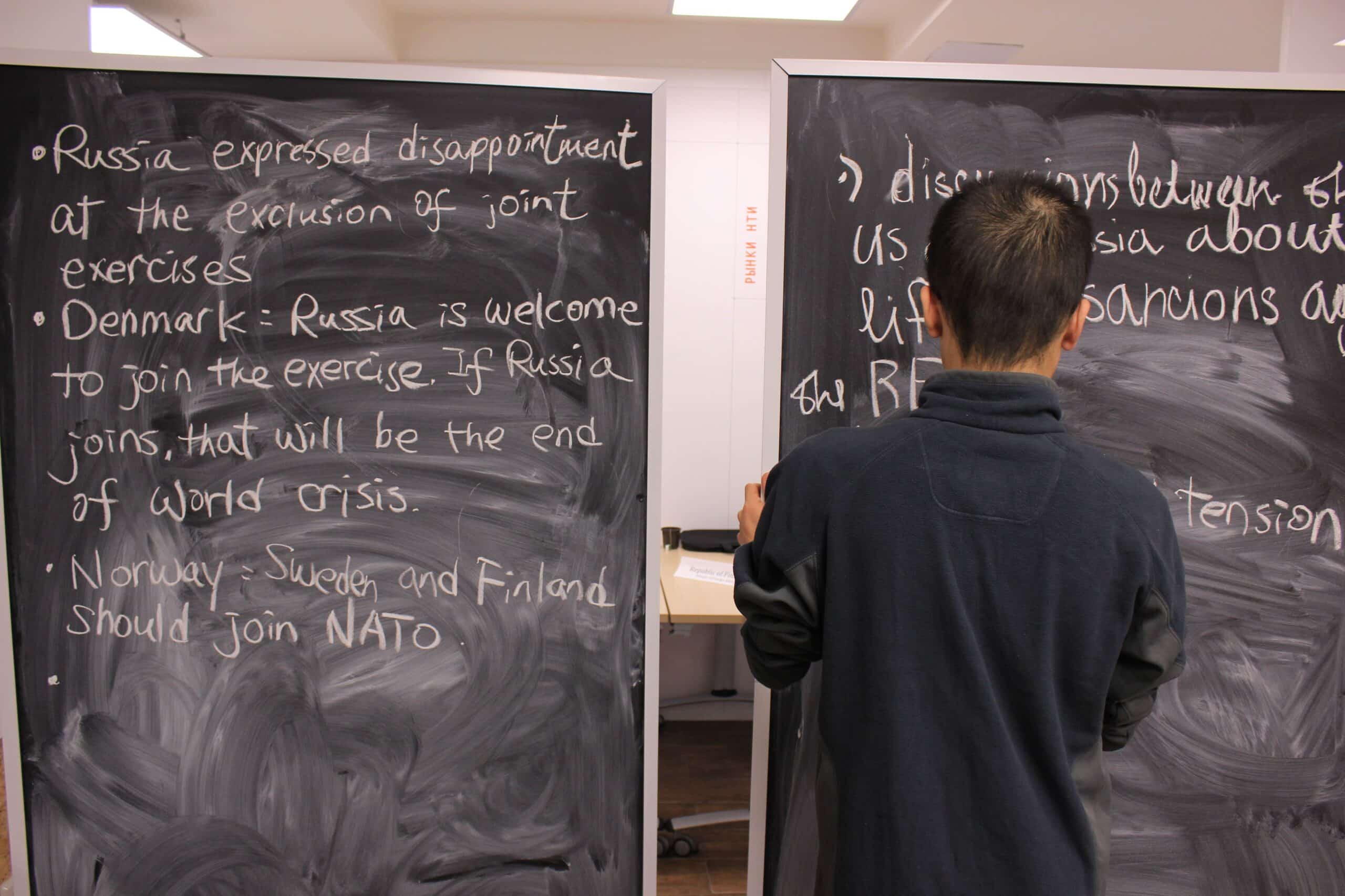 A student writing out the outcomes from their model OSCE at the Winter School on “Peace and Diplomacy in the North of Europe” 2017 at the Petrozavodsk State University, Russia