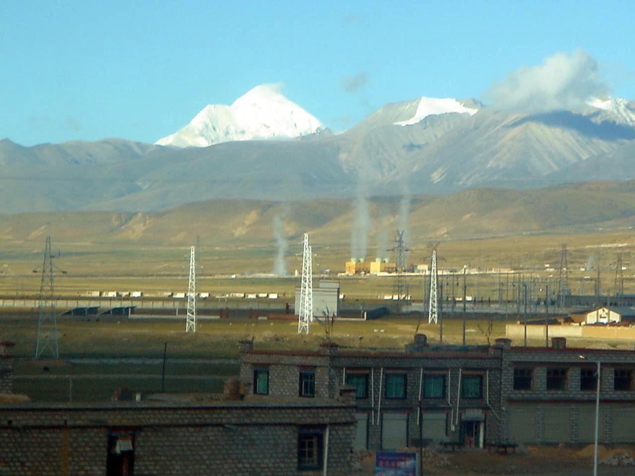 A geothermal power plant in a mountainous landscape