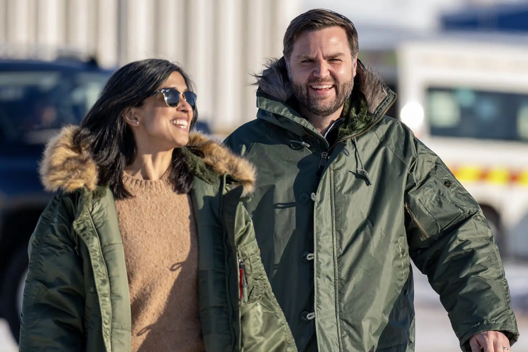 J.D. Vance and Usha Vance wearing green jackets in Greenland