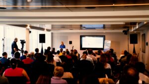 Senator Lisa Murkowski speaking in front of conference participants