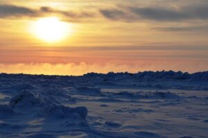 Sunset in a snowy Arctic landscape