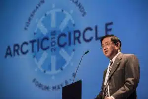 China’s Arctic ambassador Gao Feng speaks at the Arctic Circle Tórshavn Forum in 2018, standing before a microphone against a blue background