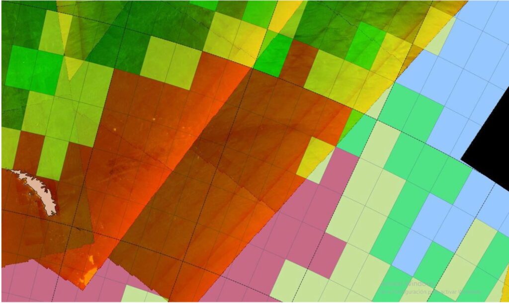 Composite map overlaying satellite imagery with colored grid cells over the Antarctic coastal region, highlighting observed sea ice and iceberg distribution. The image combines multiple satellite data layers on a geographic grid