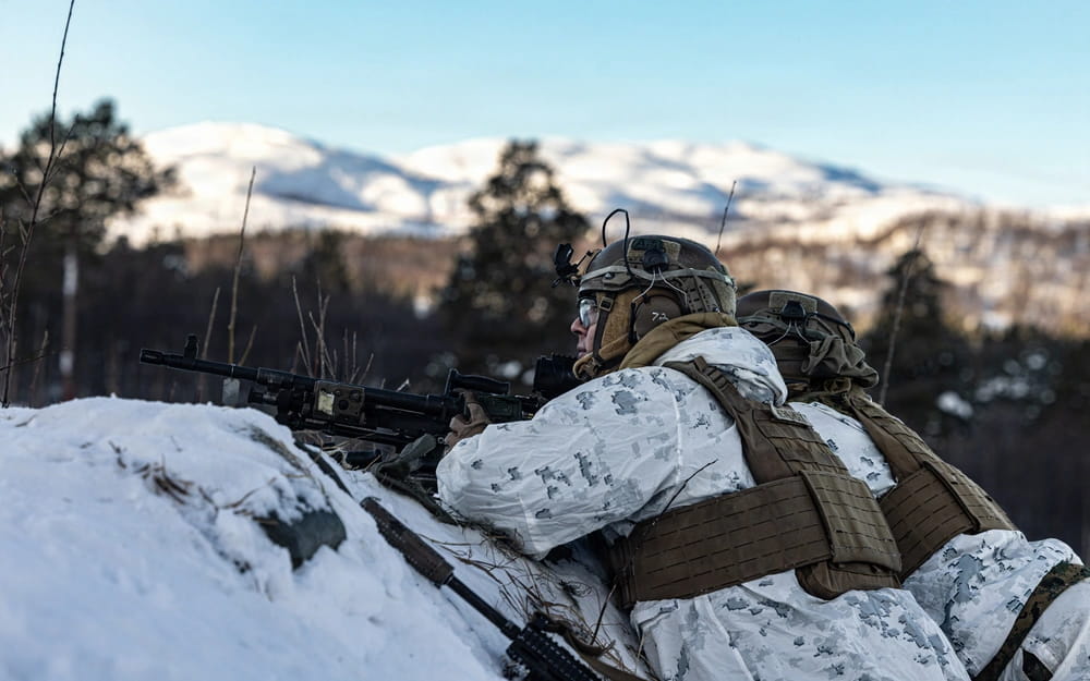 U.S. Marines fire their M240B medium machine gun in support of a squad attack during Exercise COLD RESPONSE 26 in Setermoen, Norway